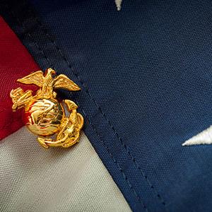 A US Marines pin on an American flag
